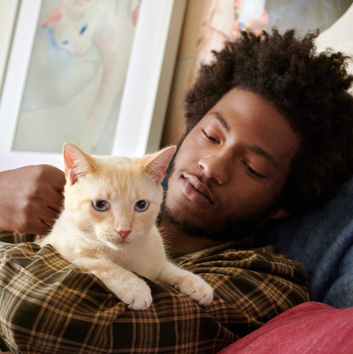 Man holding his pet cat
